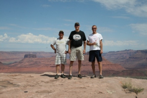 Mike, Dave, and Tyler at the overlook on Porcupine Rim, with Castle Valley in the background