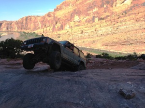 Jonny getting a little bit of air under his front tires at the last obstacle before the cliff on Moab Rim